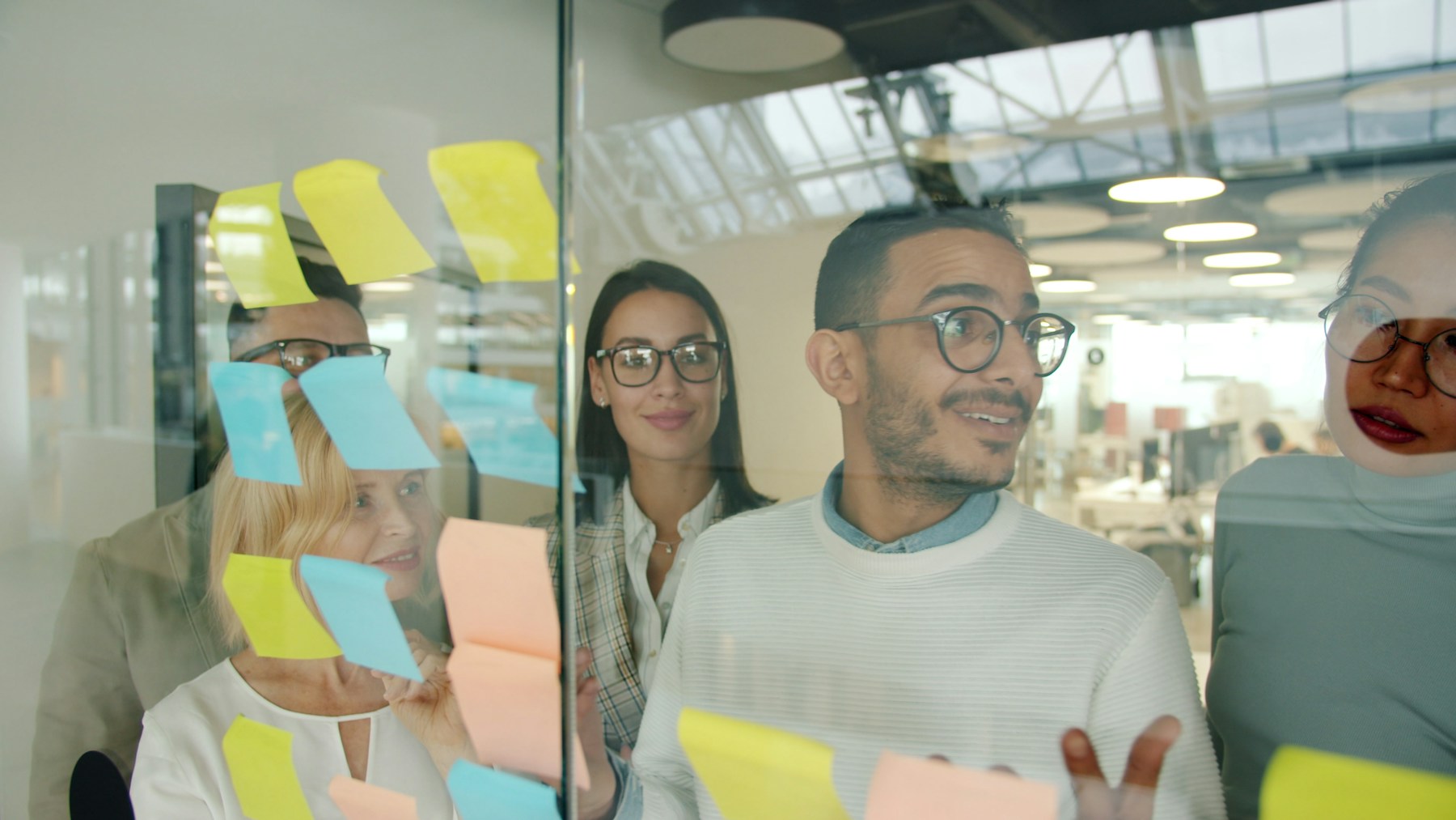 A team developing ideas together at a planning wall