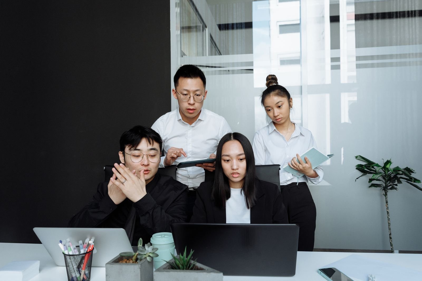 Colleagues planning together in a bright office